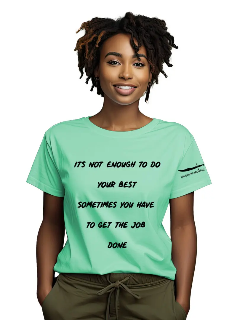 A smiling woman wearing a green t-shirt with a motivational message.