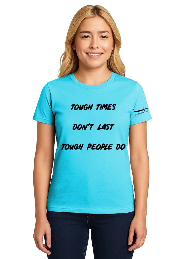 Smiling woman wearing a blue T-shirt with an inspirational quote.